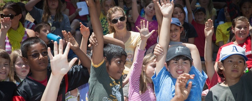 kids raising hands